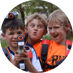 Laser Tag is a Great Boys Birthday Party Idea. These three boys have had a great time at a Laserwarriors Birthday Party and are making funny faces at the camera!